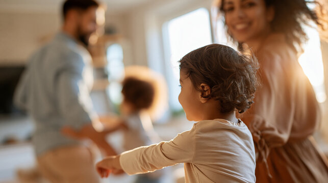 rear view of young parents playing with their children at home, backs to camera, bright cozy living room, family fun and bonding concept, parenthood, childhood, togetherness,