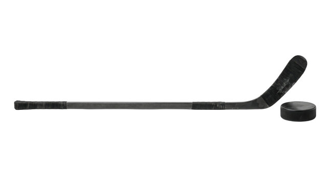 Professional black ice hockey stick and rubber puck, athletic sports equipment on white background, composite carbon fiber hockey gear