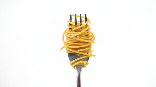 Spaghetti pasta swirled on a fork isolated on white background