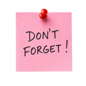 Pink reminder note with don&rsquo;t forget message and red push pin