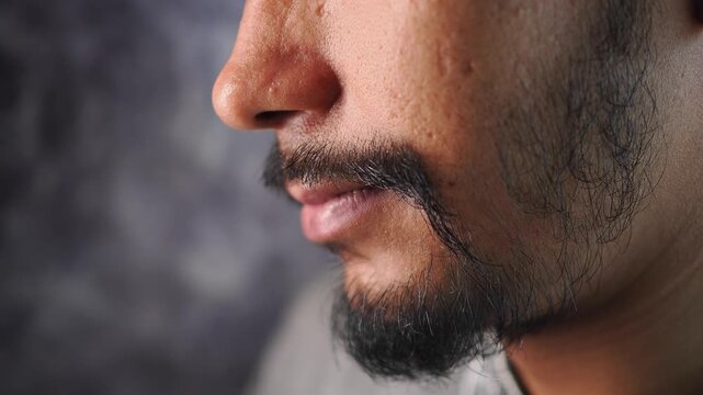 Close-up view of a man's face with facial hair