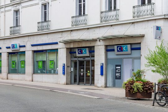 Bourg-en-Bresse, France - 26 July 2026: Exterior view of a CIC bank agency storefront with entrance, automated teller machine, and street front display.