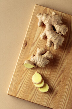 Ginger root on a wooden cutting board.