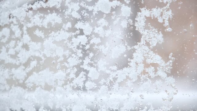 Frosty window, dreamy, coziness and tranquility. Atmosphere is calm and quiet, reflecting the peaceful stillness after a snowstorm. Frosty glass, fluffy snow, post-blizzard,  quiet winter, 