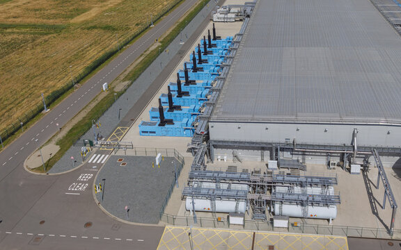 Aerial view of Google data center Agriport A7 with blue industrial cooling units and storage tanks located in Middenmeer, North Holland, Netherlands.