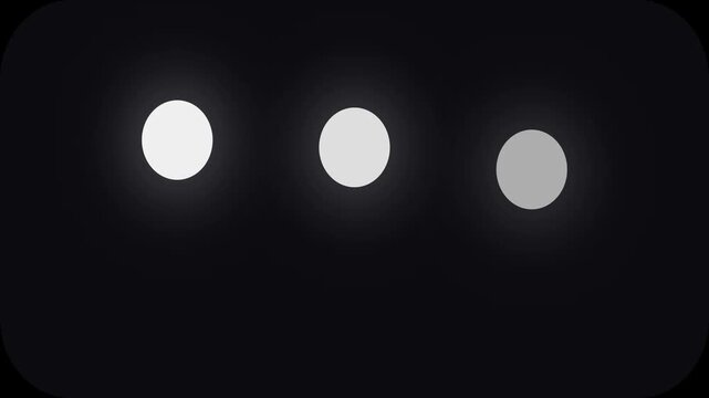 Loading animation sequence with three glowing circles pulsing in a digital video motion rhythm on a dark black background screen