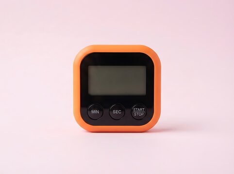 Orange Digital Kitchen Timer on Pastel Pink Background Minimalist Shot