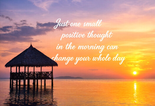 Beautiful tropical sunrise over water with a small hut and motivational quote about positivity