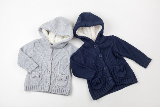 Two Cozy Knitted Baby Hooded Cardigans in Grey and Navy Blue,  Winter Jackets for Infants on White Background