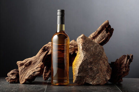 White wine with old snag and a piece of granite rock.