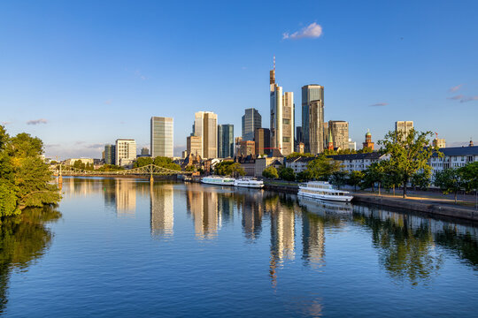 skyline of Frankfurt am Main in early morning light and reflection in river Main