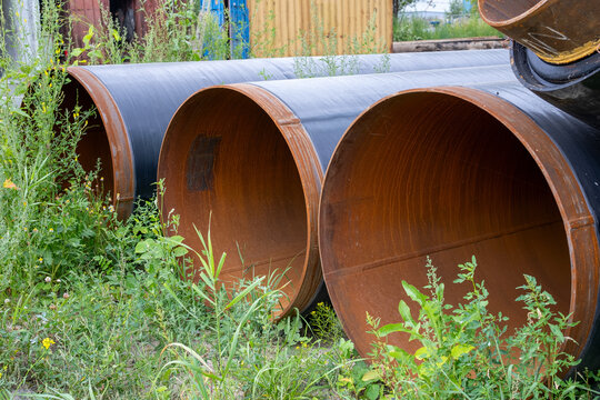 Large Steel Pipes Stacked at Industrial Construction Site