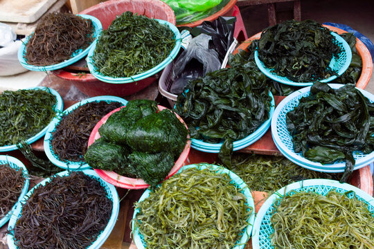 Assorted seaweeds are displayed in baskets at a market in Busan, South Korea.