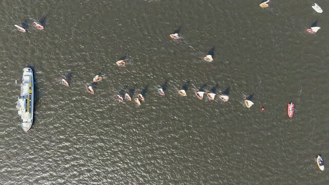 Top down view of sailboats at regatta start line