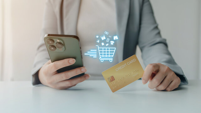 Businesswoman using a smartphone and credit card for mobile shopping and digital payment, highlighting secure ecommerce, online banking, fintech innovation, and cashless financial services.