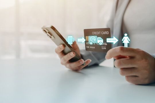 Businesswoman making a secure online payment with a smartphone and credit card, illustrating digital commerce, cashless transactions, financial technology, and mobile banking services.