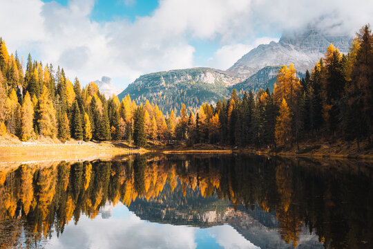 Lake Antorno with Autumn Forest and Dolomites Mountain Reflection in Italy