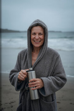Woman wrapped in a hooded towelling changing robe holding flask evoking authentic recovery moment generative AI