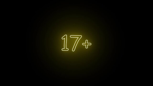 Glowing yellow neon sign displaying the number seventeen plus symbol on a dark black background representing age restriction and maturity rating warning