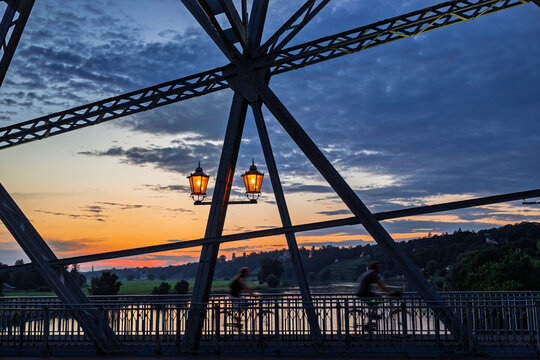 Loschwitz Bridge silhouetted with glowing lamps at twilight