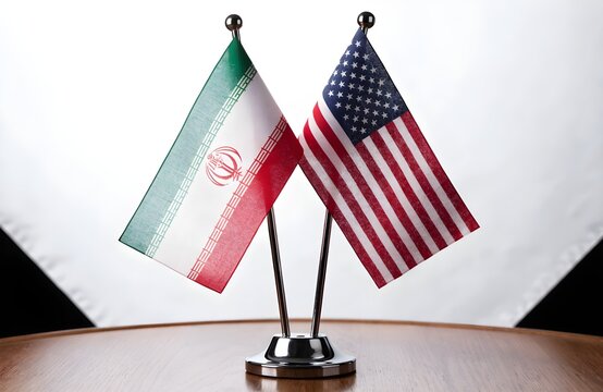 Iranian and american flags displayed together on a table