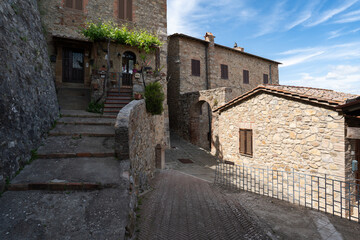 Fototapeta premium Picturesque stone alleyway and traditional architecture in Castiglione d'Orcia, Val d'Orcia, Italy