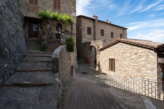 Picturesque stone alleyway and traditional architecture in Castiglione d'Orcia, Val d'Orcia, Italy