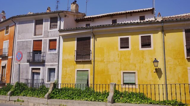 Colorful residential facades facing Plaza Mayor in the historic center of Cuenca Spain