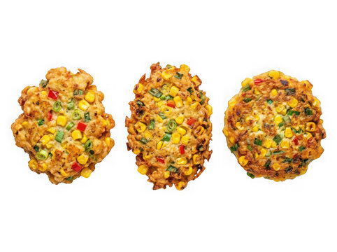 Three delicious homemade vegetable corn fritters isolated on transparent background