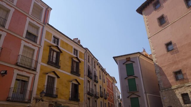 Colorful buildings on Calle Alfonso VIII beside Plaza Mayor in the old town of Cuenca Spain