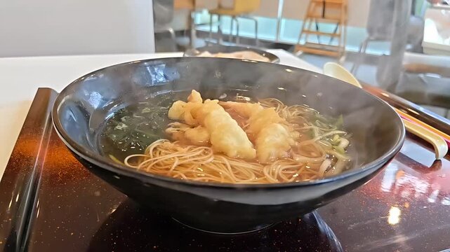 Steaming smoke from Shrimp Prawn tempura somen soba noodle soup bowl, Authentic Japanese Food, Scallion Seaweed Garnish Rotating Slow Motion Shot