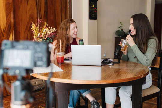 Social media content creators recording a podcast.