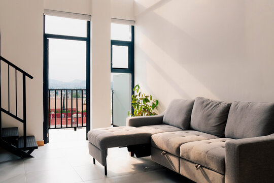 Grey sofa in bright apartment