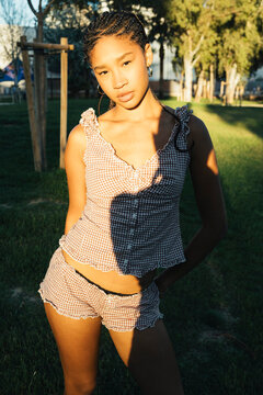Intimate outdoor portrait of thoughtful young woman 