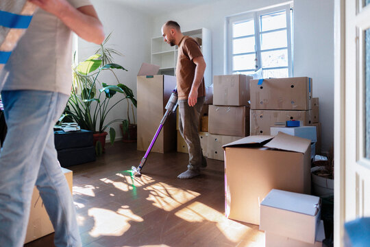 Cleaning and Unpacking Boxes During Moving Day