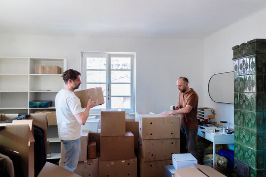 Two Men Packing Boxes During Apartment Move
