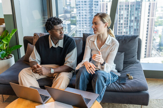 Colleagues Working Together in a Modern Office Space During the Day