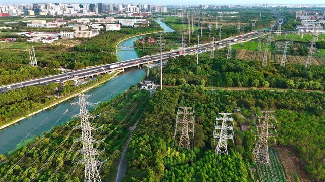 Static Aerial View of Highway, Canal and Power Transmission Lines