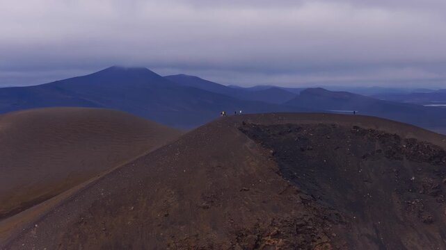 Aerial view of volcanic cinder cone with distant mountains and glacial, Iceland