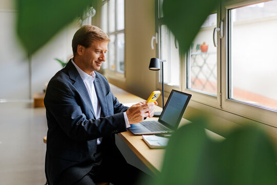 Professional man working remotely at workspace
