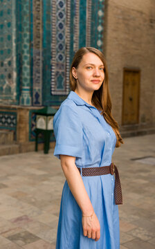 Woman Stands Near Tiled Walls in Historic Location of Samarkand
