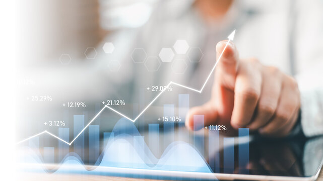 Businessman touching growing virtual stock graph display on screen. Concept of financial investment, business growth, revenue profit, data analytics, market strategy, and economic success technology