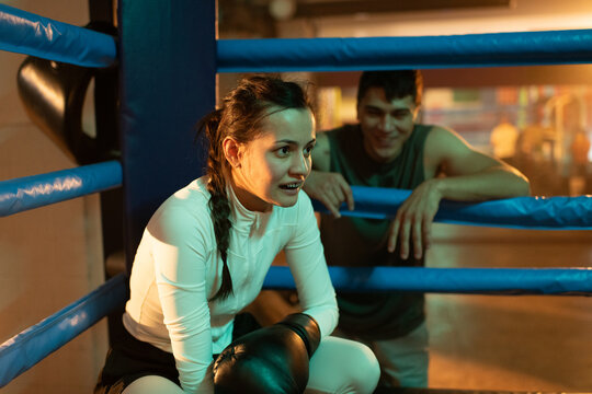 Woman boxer ready for new round in boxing ring
