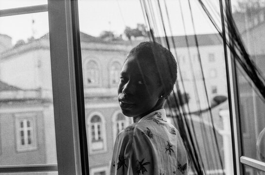 Turning by Balcony Window