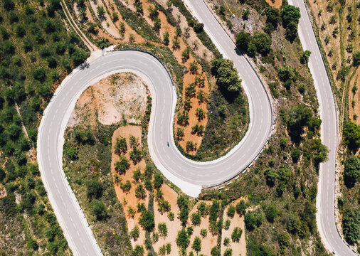 Cyclist Descending Mountain Switchback