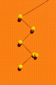 Push Pins and Thread Symbolizing Workflow, Strategy and Human Connect