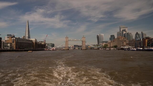 Tower Bridge and the City of London beyond a wide River Thames