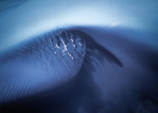 Aerial view of glacial river patterns in the Southern Region of Iceland.