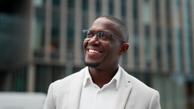 Vice president, african american businessman, closeup headshot, outdoor near office building. Black business man smiling, works as vice president, building strong client partnerships, growing network.