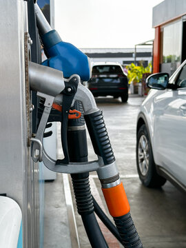  Modern car at petrol station ready for refueling. Closeup.